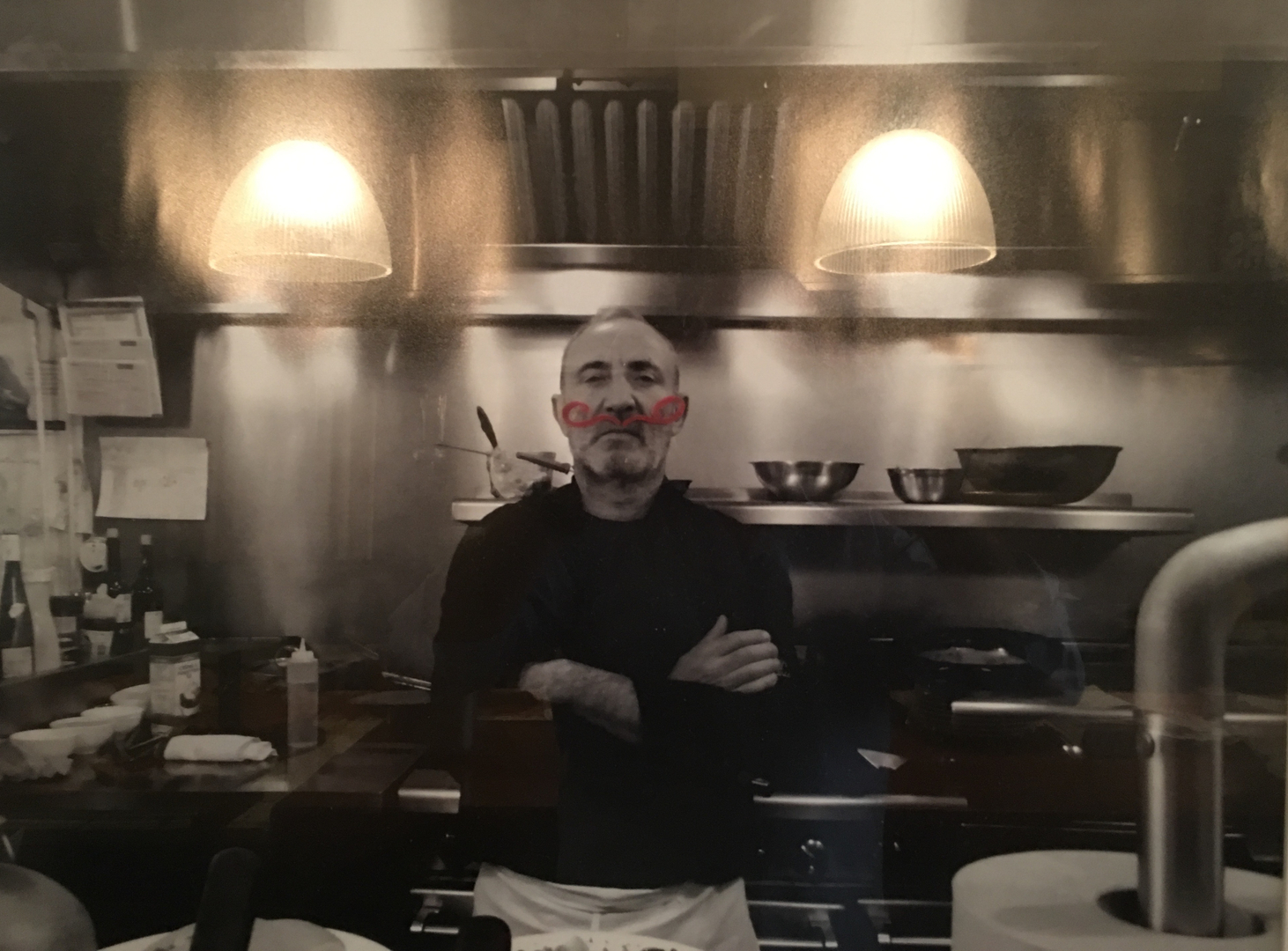 A man standing in front of an oven.